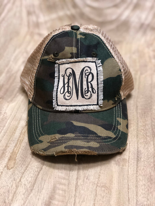 Distressed hat with black monogram